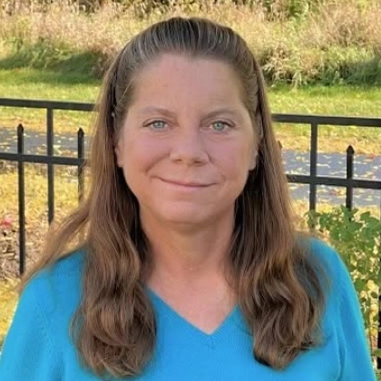 Close-up portrait of Dr. Jennifer Lebbin outdoors wearing a blue sweater