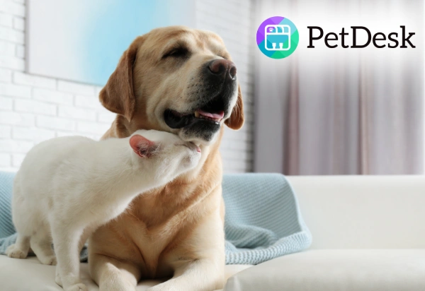 Dog and cat cuddling together next to the PetDesk app logo